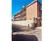 Exterior view of a brick building with metal staircases and secure entryway at 529 N Washington St # 304, Denver, CO 80203