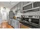 Well-maintained kitchen with stainless steel appliances, granite countertops, and subway tile backsplash at 529 N Washington St # 304, Denver, CO 80203