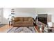 Cozy living room featuring a comfortable sofa and stylish rug on hardwood flooring at 529 N Washington St # 304, Denver, CO 80203