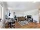 Spacious living room with hardwood floors, comfortable seating, and a dedicated workspace at 529 N Washington St # 304, Denver, CO 80203