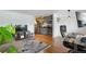 Inviting living space with hardwood floors connecting the living room to the modern kitchen at 529 N Washington St # 304, Denver, CO 80203