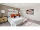 Bright bedroom with a queen-size bed and stylish decor at 13455 Valentia Pl, Thornton, CO 80602