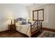 Charming bedroom with a wooden bed frame and hardwood floors at 1043 Meteor Pl, Castle Rock, CO 80108