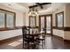 Bright dining area with a wooden table and access to a patio at 1043 Meteor Pl, Castle Rock, CO 80108