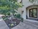 House exterior featuring a grand entrance and manicured landscaping at 1043 Meteor Pl, Castle Rock, CO 80108