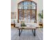 Living room with a large, arched window and comfortable seating at 1043 Meteor Pl, Castle Rock, CO 80108