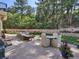 Backyard patio with seating area and stone retaining wall at 1043 Meteor Pl, Castle Rock, CO 80108