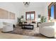 Relaxing sitting area with comfortable seating and large windows at 1043 Meteor Pl, Castle Rock, CO 80108