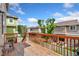 Wooden back deck with railing overlooking fenced yards and neighborhood houses at 3565 E 141St Dr, Thornton, CO 80602