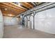 Unfinished basement featuring a concrete floor and exposed ceiling with utilities and insulation at 3565 E 141St Dr, Thornton, CO 80602