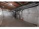 An unfinished basement with mechanicals and insulated walls, offering a blank canvas for future finishing at 3565 E 141St Dr, Thornton, CO 80602