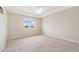Bright bedroom with a tray ceiling, carpet flooring, neutral walls, and a large window offering natural light at 3565 E 141St Dr, Thornton, CO 80602