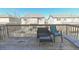 A deck featuring outdoor seating and views of adjacent houses, perfect for relaxing at 3565 E 141St Dr, Thornton, CO 80602