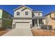 Charming two-story home featuring a two-car garage, neutral siding, and well-maintained front yard at 3565 E 141St Dr, Thornton, CO 80602