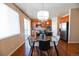 Bright kitchen boasts an island, wood cabinets, stainless steel appliances and an adjacent dining area at 3565 E 141St Dr, Thornton, CO 80602
