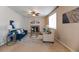 Cozy living room boasts a fireplace, ceiling fan, stylish furnishings, and abundant natural light at 3565 E 141St Dr, Thornton, CO 80602