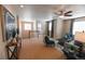 Cozy loft featuring comfortable seating, stylish decor, and easy access to the laundry room at 3565 E 141St Dr, Thornton, CO 80602