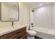 Bathroom featuring modern fixtures, a soaking tub, and stylish tiling at 3201 Albion St, Denver, CO 80207