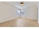 Bright bedroom with hardwood floors, white trim, and a window with natural light at 3201 Albion St, Denver, CO 80207