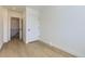 Bedroom with hardwood floors with ensuite bathroom and walk-in closet at 3201 Albion St, Denver, CO 80207