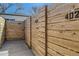 New wooden fence with unit numbers dividing the backyard and creating clearly defined spaces at 3201 Albion St, Denver, CO 80207