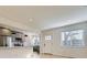 Open-concept living space with a view into the kitchen and dining nook at 3201 Albion St, Denver, CO 80207