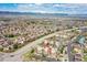 Community aerial view showcases the building's location and surrounding neighborhood with mountain views at 1044 Rockhurst Dr # 401, Highlands Ranch, CO 80129