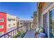 Private balcony with a comfortable wicker chair, offering an outdoor relaxation space with city views at 1044 Rockhurst Dr # 401, Highlands Ranch, CO 80129