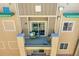 Inviting balcony features comfortable seating, creating an ideal outdoor extension of the living space at 1044 Rockhurst Dr # 401, Highlands Ranch, CO 80129