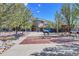 Attractive community center, with a bronze antelope statue, benches, and landscaping at 1044 Rockhurst Dr # 401, Highlands Ranch, CO 80129