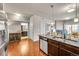 Open concept kitchen with granite countertops, stainless steel appliances, and hardwood floors at 1044 Rockhurst Dr # 401, Highlands Ranch, CO 80129