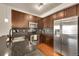 Modern kitchen with stainless steel appliances, ample cabinet space, and stylish backsplash at 1044 Rockhurst Dr # 401, Highlands Ranch, CO 80129