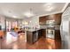 Open concept kitchen and living area with stainless steel appliances and modern finishes at 1044 Rockhurst Dr # 401, Highlands Ranch, CO 80129