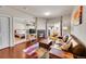 Cozy living room with a fireplace, comfortable seating, and a view into the bedroom at 1044 Rockhurst Dr # 401, Highlands Ranch, CO 80129