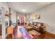 Bright living room with fireplace, comfortable seating, and access to a balcony with a great view at 1044 Rockhurst Dr # 401, Highlands Ranch, CO 80129