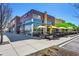 Waldo's Restaurant exterior featuring curbside pickup, outdoor patio seating, and modern architectural design at 1044 Rockhurst Dr # 401, Highlands Ranch, CO 80129
