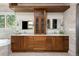 Spacious bathroom with double vanity, stone walls, lots of natural light, and custom cabinetry at 2535 W 115Th Dr, Westminster, CO 80234