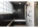 Luxurious shower with custom tile work, multiple shower heads, and natural light at 2535 W 115Th Dr, Westminster, CO 80234