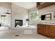 Bathroom featuring stacked stone walls, soaking tub, fireplace, and a modern vanity at 2535 W 115Th Dr, Westminster, CO 80234