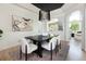 Formal dining room featuring a modern chandelier, elegant decor, and a stylish area rug at 2535 W 115Th Dr, Westminster, CO 80234