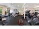 Home gym with workout equipment, mirrored wall, and natural light from backyard views at 2535 W 115Th Dr, Westminster, CO 80234