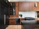 Sleek kitchen with custom cabinets, stainless steel appliances, and elegant countertop at 2535 W 115Th Dr, Westminster, CO 80234