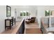 Bright, open living area with hardwood floors, a leather chair, and a window seat at 2535 W 115Th Dr, Westminster, CO 80234