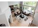 Open floor plan featuring a living room, dining area, and kitchen with backyard views at 2535 W 115Th Dr, Westminster, CO 80234