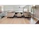 Upstairs living area with neutral furniture, hardwood floors, and backyard views at 2535 W 115Th Dr, Westminster, CO 80234