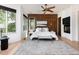 Tranquil main bedroom with wood accents, plush bedding, a fireplace, and generous natural light at 2535 W 115Th Dr, Westminster, CO 80234