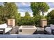 Cozy patio featuring comfortable seating around a contemporary fire pit with lush surroundings at 2535 W 115Th Dr, Westminster, CO 80234