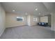 Spacious basement featuring neutral carpet, recessed lighting and a pull-down bed at 2991 S Zeno Way, Aurora, CO 80013