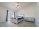Bright bedroom features a ceiling fan, private access to a deck, and stylish decor at 2991 S Zeno Way, Aurora, CO 80013
