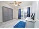 Bedroom features a pull-down bed, a dresser and sliding glass door to the outside at 2991 S Zeno Way, Aurora, CO 80013